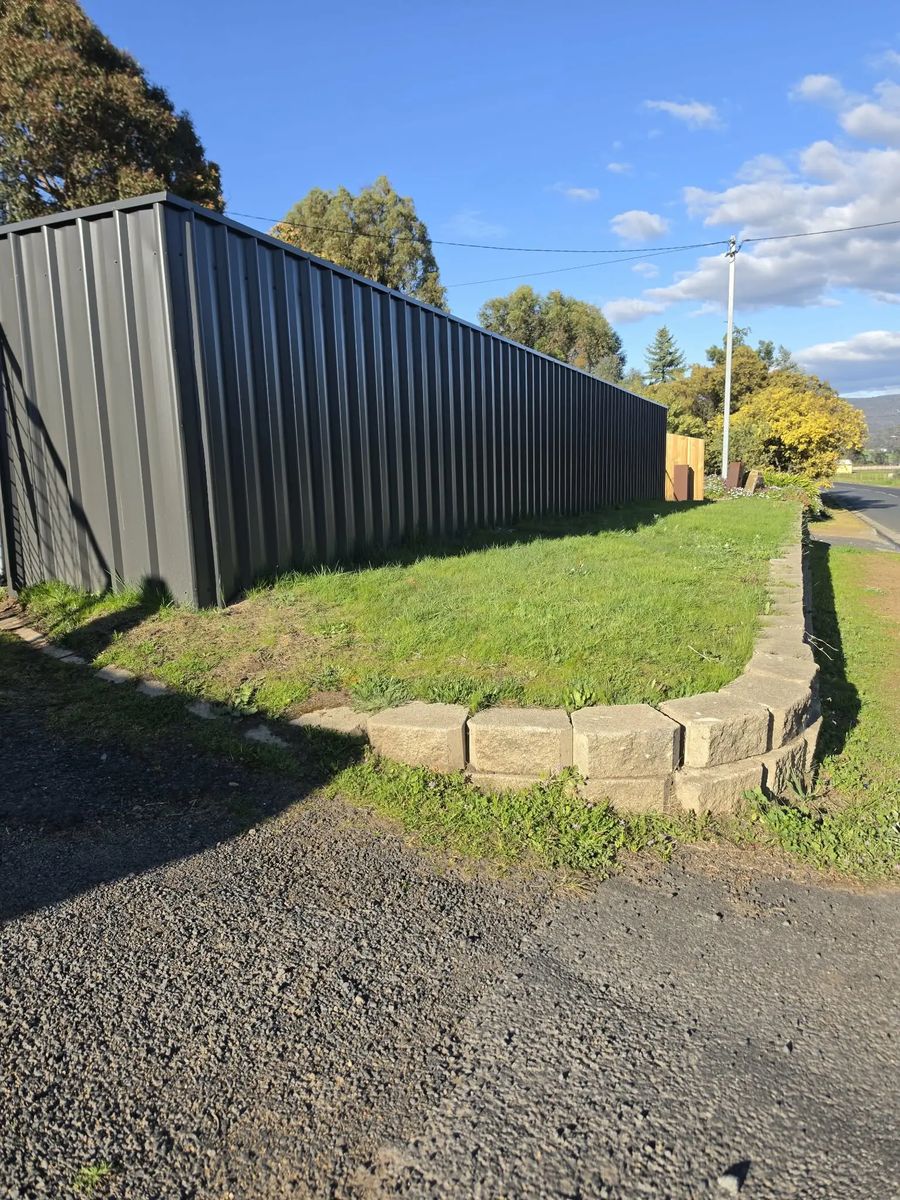Colorbond fence above a block retaining edge
